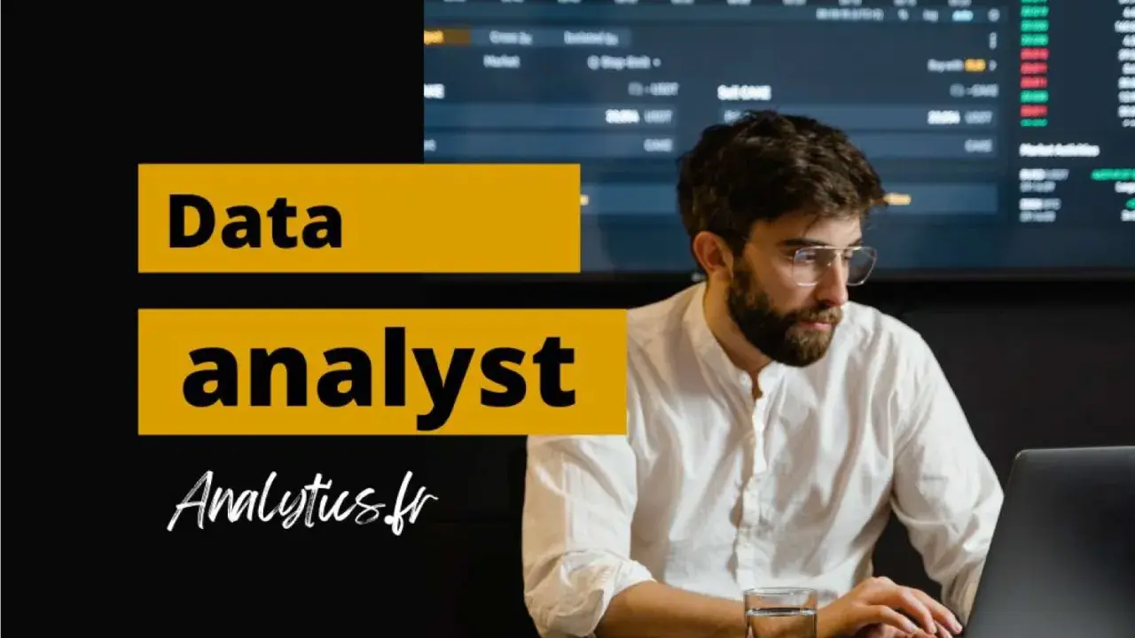 Un homme concentré sur son ordinateur portable, prêt à devenir data analyst. Graphiques financiers en arrière-plan.